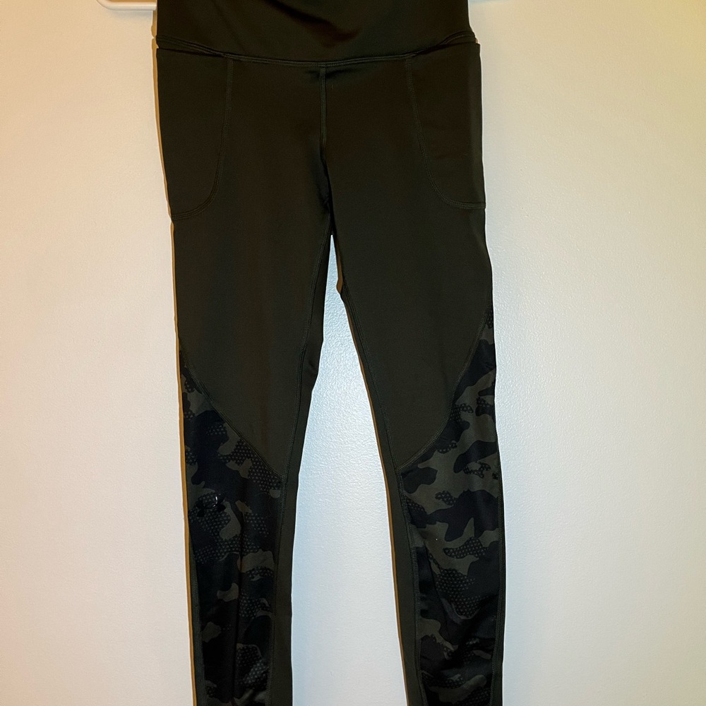 army green leggings with army print on the bottom.